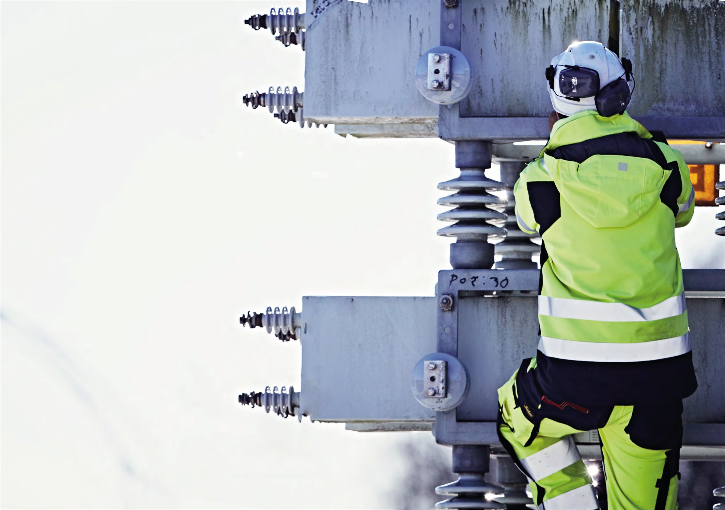 Utility professionals working near electrical distribution equipment